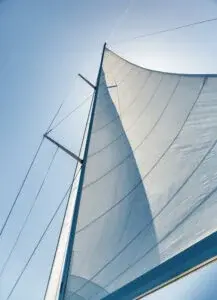 Sail on sky background, part of luxury water transport, summer adventure on sailboat, freedom and active lifestyle concept